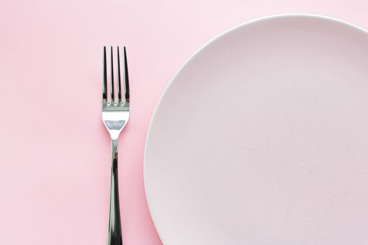 Empty plate and cutlery as mockup set on pink background, top tableware for chef table decor and menu branding design