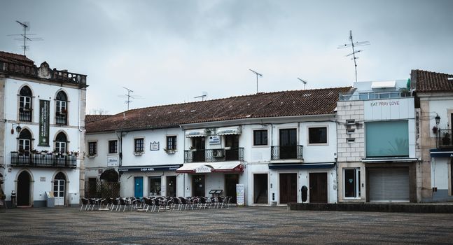 Batalha, Portugal - April 13, 2019: view of the small tourist town center with its restaurants on a spring evening