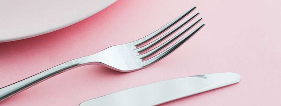 Empty plate and cutlery as mockup set on pink background, top tableware for chef table decor and menu branding design