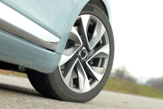 Wheel on a white large luxury car