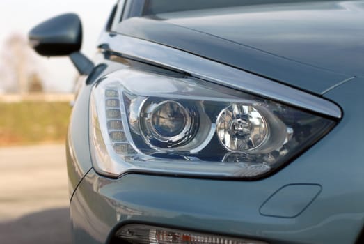 Headlight of the modern car photographed close-up