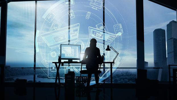 A woman web developer working at a computer in her office against the background of a panoramic window and infographic.