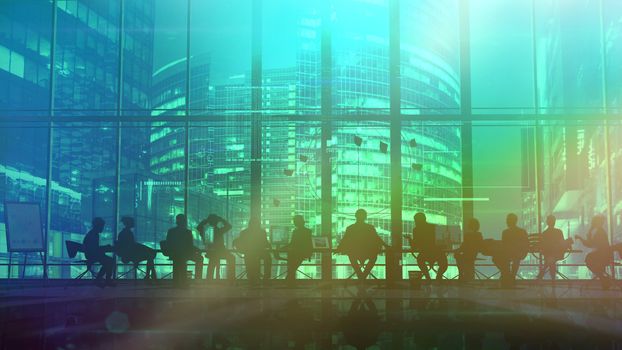 Evening meeting of a team of businessmen in the office at a big table. On the background of the evening city and skyscrapers, infographic information of the current project is visible.