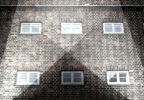 Aged and weathered brick wall textures with bright spotlight illumination