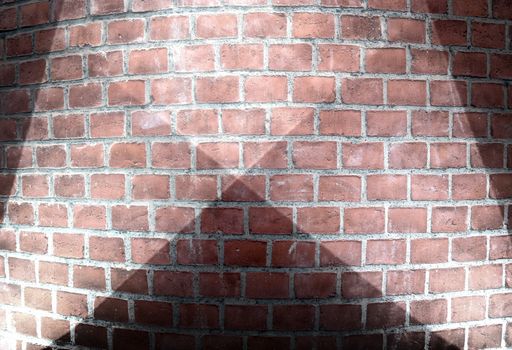 Aged and weathered brick wall textures with bright spotlight illumination