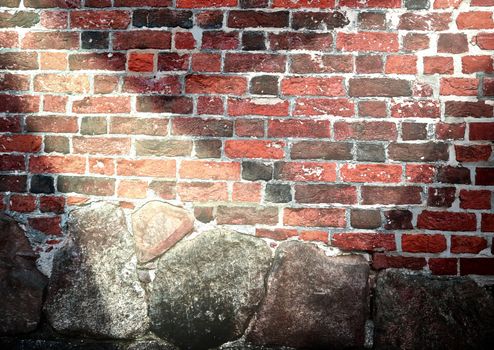 Aged and weathered brick wall textures with bright spotlight illumination