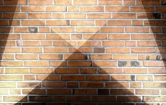 Aged and weathered brick wall textures with bright spotlight illumination