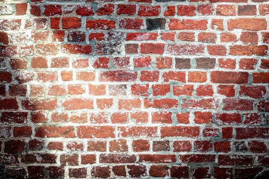 Aged and weathered brick wall textures with bright spotlight illumination