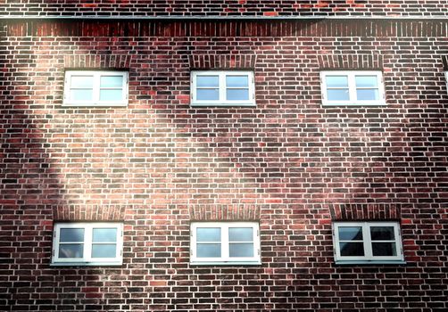 Aged and weathered brick wall textures with bright spotlight illumination