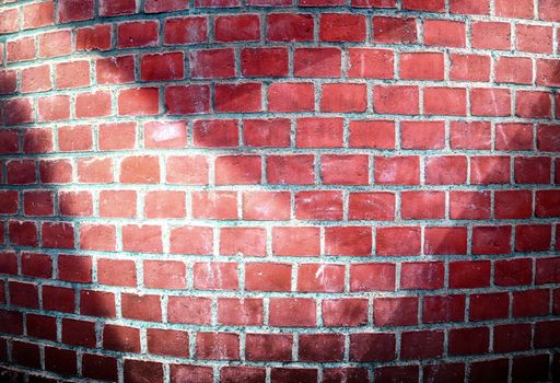 Aged and weathered brick wall textures with bright spotlight illumination