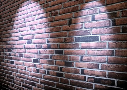 Aged and weathered brick wall textures with bright spotlight illumination