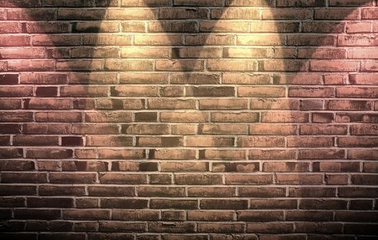 Aged and weathered brick wall textures with bright spotlight illumination