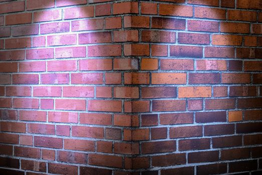 Aged and weathered brick wall textures with bright spotlight illumination