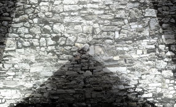 Aged and weathered brick wall textures with bright spotlight illumination