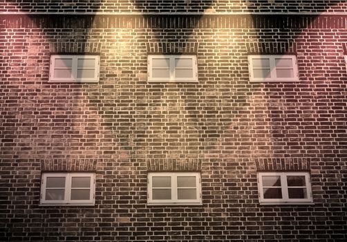 Aged and weathered brick wall textures with bright spotlight illumination