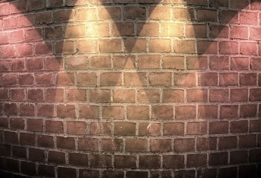 Aged and weathered brick wall textures with bright spotlight illumination