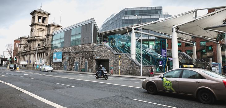 Dublin, Ireland - February 12, 2019: Street atmosphere and architecture before the DART Connolly train station in the city center on a winter day