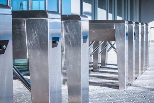 Turnstile. Checkpoint. Automatic access control. Access system to the building. Metal turnstile.