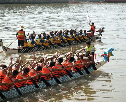 KAOHSIUNG, TAIWAN - JUNE 3: To celebrate the Duanwu Festival Kaohsiung City in Taiwan conducts Dragon Boat races on the Love River on June 3, 2011 in Kaohsiung, Taiwan.