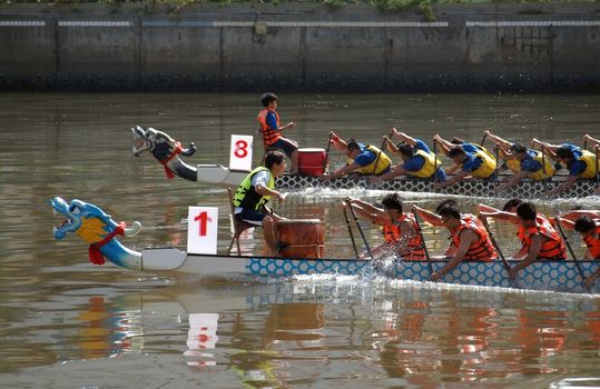 KAOHSIUNG, TAIWAN - JUNE 3: To celebrate the Duanwu Festival Kaohsiung City in Taiwan conducts Dragon Boat races on the Love River on June 3, 2011 in Kaohsiung, Taiwan.
