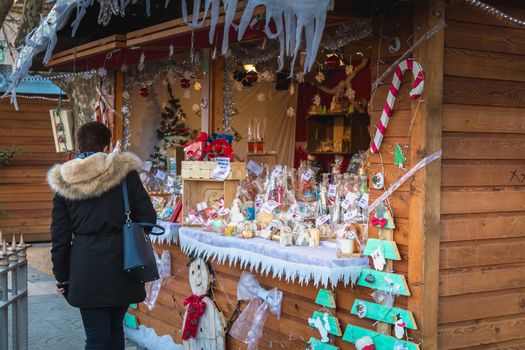 Marseillan, France - December 30, 2018: Street atmosphere in the Christmas market of the city where people walk on a winter day