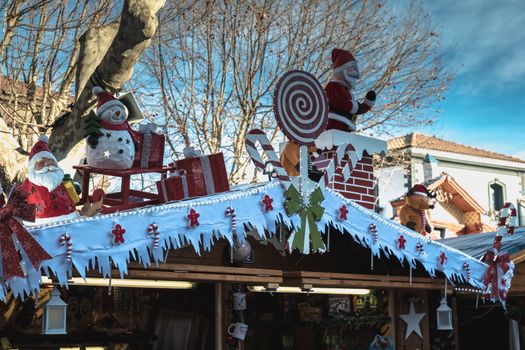 Marseillan, France - December 30, 2018: Street atmosphere in the Christmas market of the city where people walk on a winter day