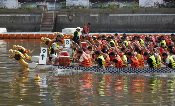 KAOHSIUNG, TAIWAN - JUNE 3: To celebrate the Duanwu Festival Kaohsiung City in Taiwan conducts Dragon Boat races on the Love River on June 3, 2011 in Kaohsiung, Taiwan.