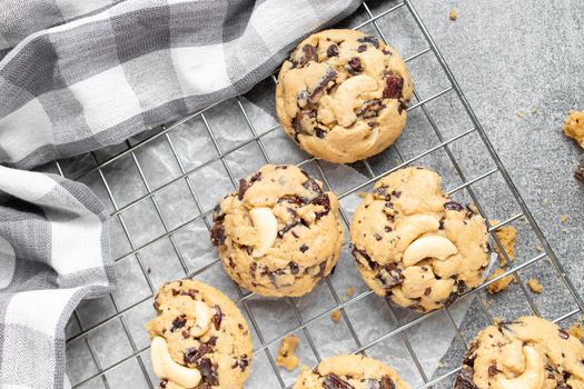 Stack of tasty chocolate cookies on gray table