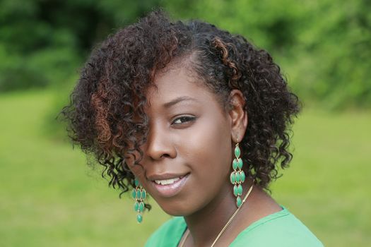 Close-up outdoor portrait of healthy and beautiful African American woman