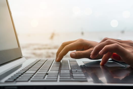 Woman hand using laptop to work study on work desk with clean nature background background. Business, financial, trade stock maket and social network concept.