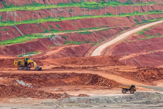 Part of a pit with big mining truck working