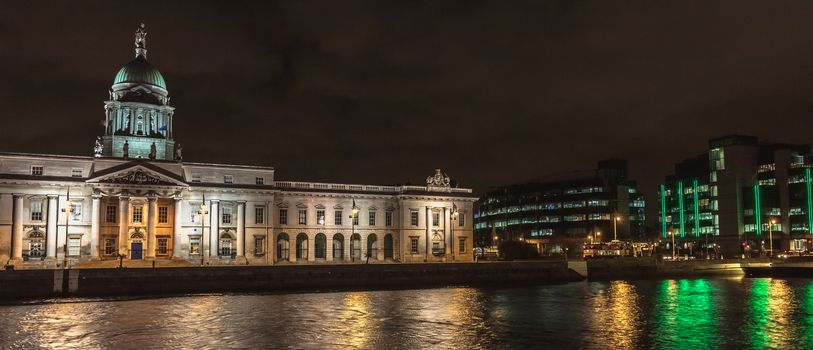Dublin, Ireland - February 15, 2019: Architectural detail of the Custom House housing the Department of Housing, Planning and Local Government at night on a winter day