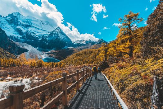 Pearl Lake or Zhuoma La Lake and snow mountain in autumn in Yading Nature reserve, Sichuan, China.