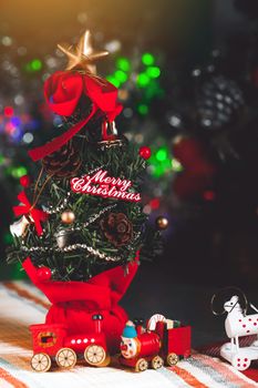 Christmas background with decorations and gift boxes on wooden