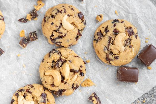 Stack of tasty chocolate cookies on gray table