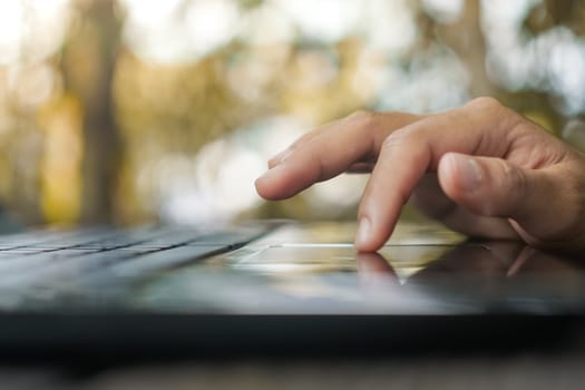 Woman hand using laptop to work study on work desk with clean nature background background. Business, financial, trade stock maket and social network concept.