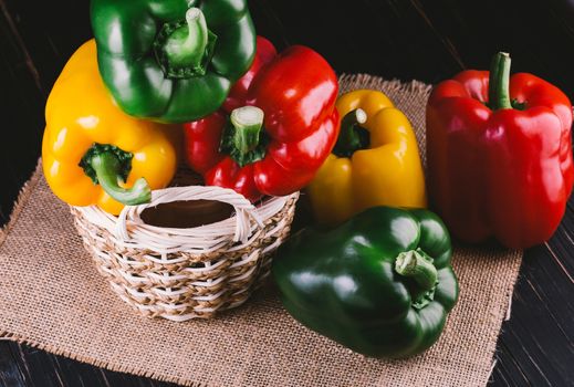 Three sweet peppers on a wooden background, Cooking vegetable salad