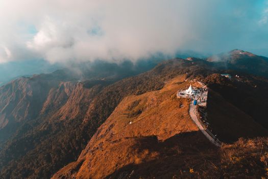 Top View Mulayit Taung golden light of the morning sun and the mist covered on Mount Mulayit,Myanmar