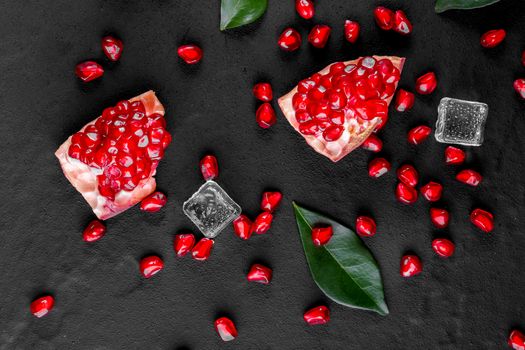 Ripe pomegranate fruits on the wooden background