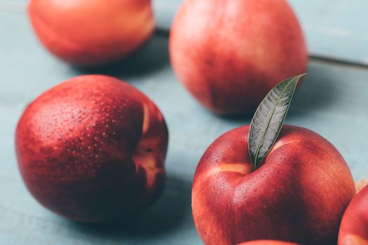 Sweet nectarine on wooden background