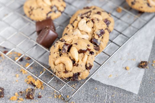 Stack of tasty chocolate cookies on gray table