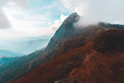 Top View Mulayit Taung golden light of the morning sun and the mist covered on Mount Mulayit,Myanmar