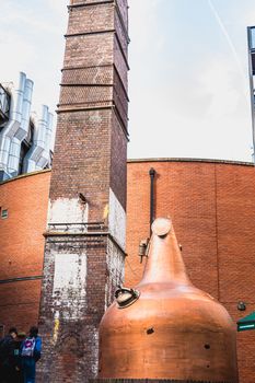 Dublin, Ireland - February 16, 2019: Tourists taking their picture in front of the old Jameson Brand Irish Whiskey Distillery on a winter's day