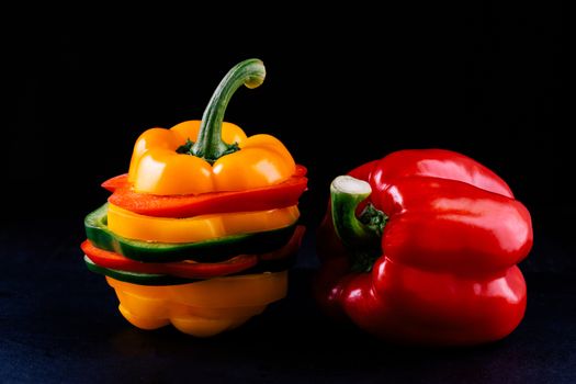 Three sweet peppers on a wooden background, Cooking vegetable salad