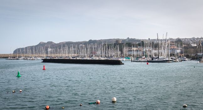 Howth near Dublin, Ireland - February 15, 2019: view of the marina of the city where are parked tourist boats on a winter day