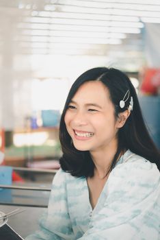 Asian pretty cute woman eating thai food with rice and many food on dining table in restaurant with happy and enjoy emotion