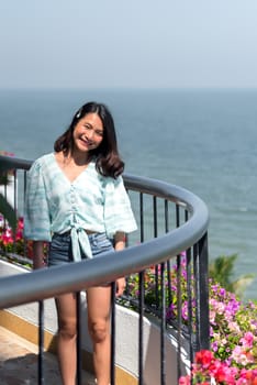 Asian pretty woman relax at sea viewpoint with happy and fun emotion in concept travel, vacation, leisure in life