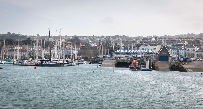 Howth near Dublin, Ireland - February 15, 2019: view of the marina of the city where are parked tourist boats on a winter day