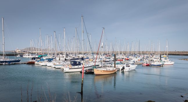 Howth near Dublin, Ireland - February 15, 2019: view of the marina of the city where are parked tourist boats on a winter day