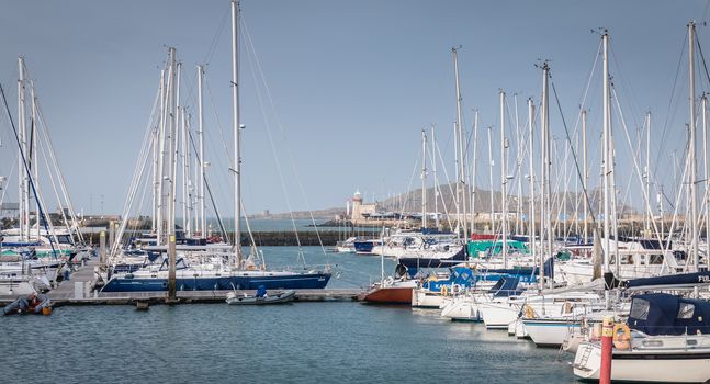 Howth near Dublin, Ireland - February 15, 2019: view of the marina of the city where are parked tourist boats on a winter day